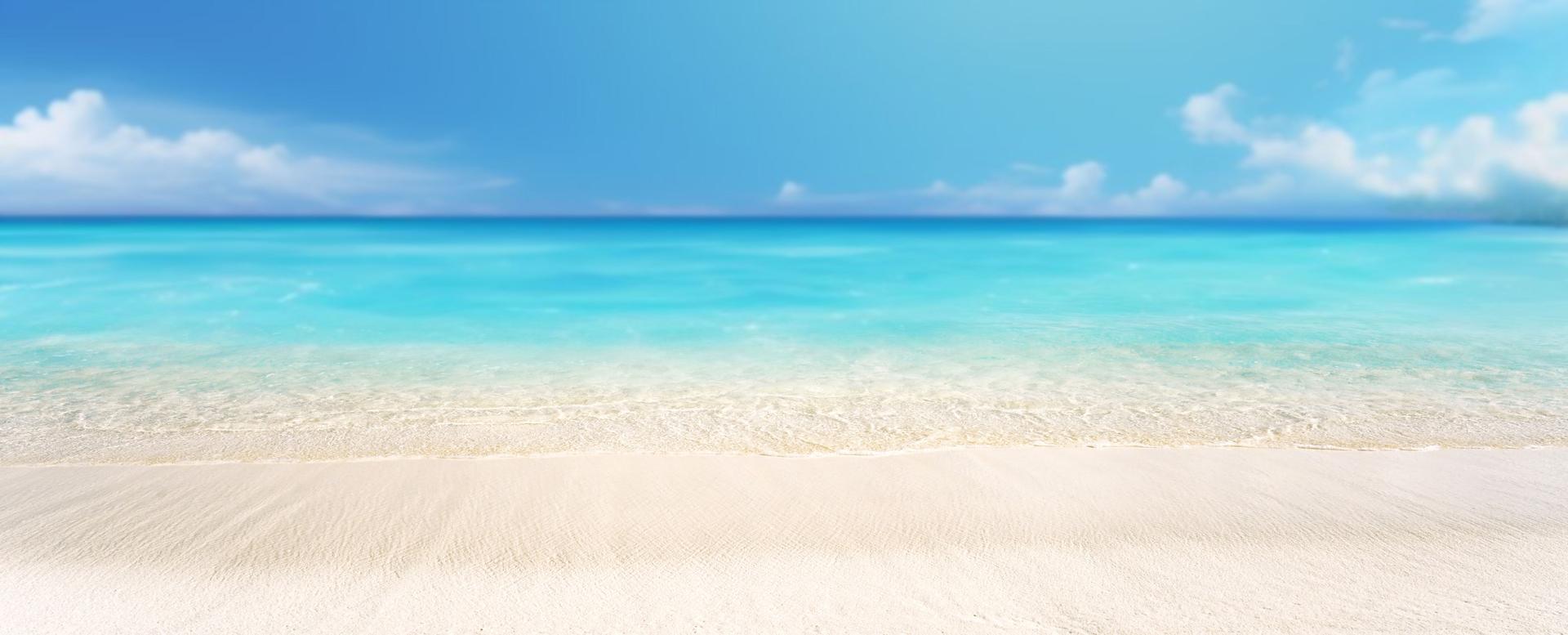 Beautiful background image of the coast of a tropical island turning into the endless expanse of the ocean.